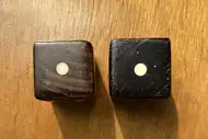 Two dice. The first with the 1 side up, the second with the 1 side up