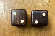 Two dice. The first with the 2 side up, the second with the 2 side up
