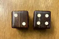 Two dice. The first with the 2 side up, the second with the 4 side up