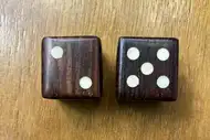 Two dice. The first with the 2 side up, the second with the 5 side up