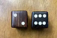Two dice. The first with the 2 side up, the second with the 6 side up