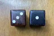 Two dice. The first with the 3 side up, the second with the 1 side up