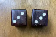 Two dice. The first with the 3 side up, the second with the 3 side up