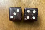 Two dice. The first with the 3 side up, the second with the 4 side up