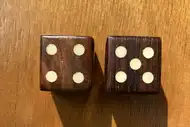 Two dice. The first with the 4 side up, the second with the 5 side up