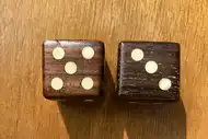 Two dice. The first with the 5 side up, the second with the 3 side up