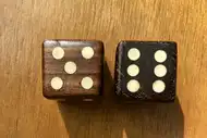 Two dice. The first with the 5 side up, the second with the 6 side up