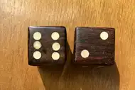 Two dice. The first with the 6 side up, the second with the 2 side up