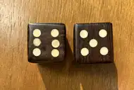 Two dice. The first with the 6 side up, the second with the 5 side up